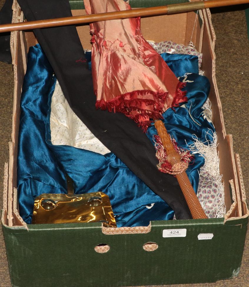 Lot 424 - A box of textiles including a parasol with carved handle, two kimono including embroidered silk...