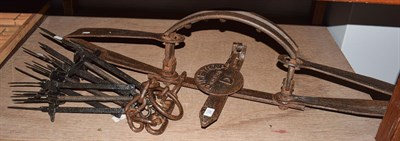 Lot 437 - A 19th century iron bear / man trap 'Duke trap #6', 105cm long, together with three mole traps