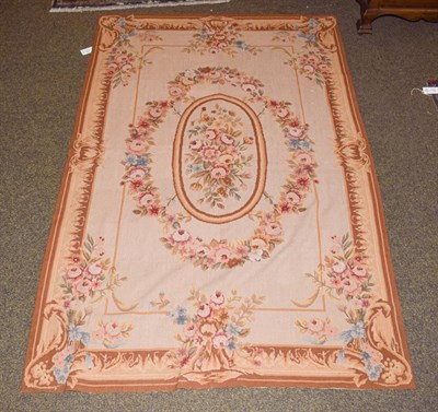 Lot 1148 - Aubusson style needlepoint rug, the field with oval floral medallion framed by floral borders,...
