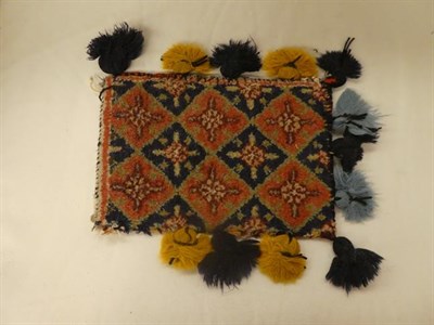 Lot 1149 - A Turkmen rug the field with two columns of parasol motifs enclosed by latch hook borders, 127cm by