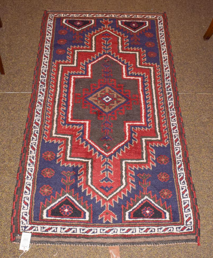Lot 1157 - A West Anatolian village rug, the field with stepped medallion enclosed by narrow borders, 163cm by