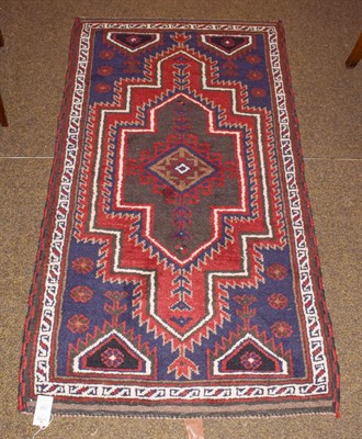 Lot 1157 - A West Anatolian village rug, the field with stepped medallion enclosed by narrow borders, 163cm by