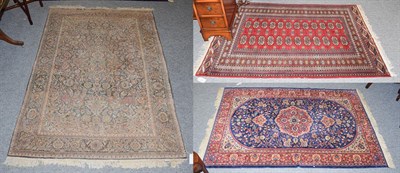 Lot 1159 - A Lohore Bukhara rug, the crimson field with two columns of guls enclosed by multiple borders 168cm