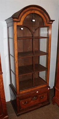 Lot 1187 - A 20th century oak astragal glazed dome-topped display cabinet, raised on a single drawer base,...