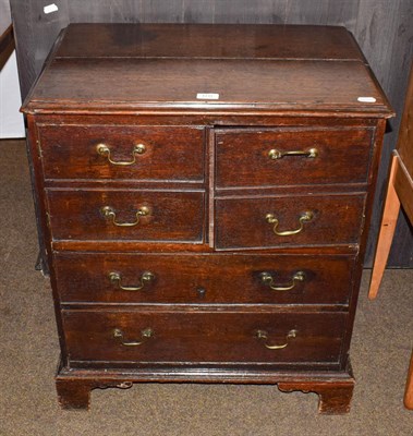 Lot 1211 - A George III oak chest of small proportions, the top two drawers converted to a cupboard, 66cm...