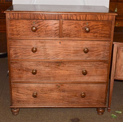 Lot 1233 - A Victorian mahogany chest of drawers with turned handles and raised on turned feet, 108cm by...
