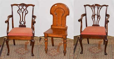 Lot 1239 - A Victorian carved oak hall chair and two child's Chippendale style carved mahogany armchairs (3)
