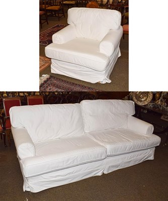 Lot 1240 - A modern white upholstered two-piece suite, comprising three-seater settee and an armchair