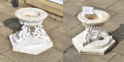 Lot 1241 - A pair of Victorian cast iron urn bases, by Hunt & Pickering, repainted white, of circular form...