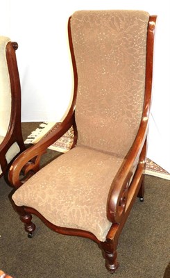 Lot 1251 - A Victorian mahogany scroll arm nursing chair