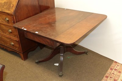 Lot 1269 - A 19th century mahogany single-drawer Pembroke table, raised on a turned centre pedestal and...