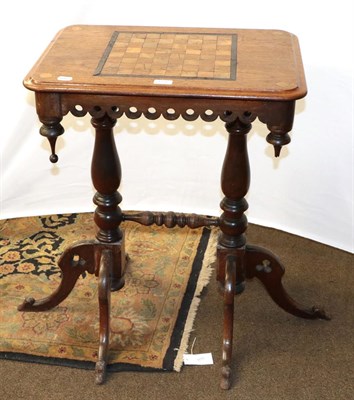Lot 1271 - A Victorian mahogany inlaid games table, raised on twin baluster supports, 60cm by 42cm by 77cm