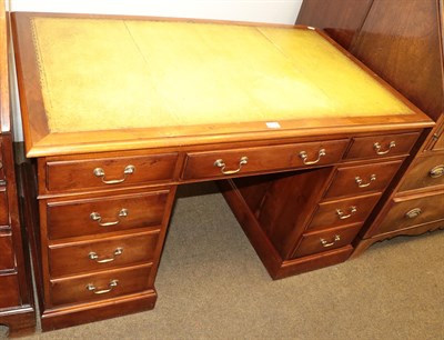 Lot 1272 - Rackstraw Georgian style leather top pedestal desk, 129cm by 77cm by 77cm