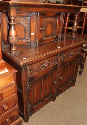 Lot 1280 - A 20th century carved and panel-oak court cupboard, 118cm by 53cm by 140cm