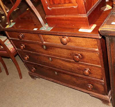 Lot 1283 - A Georgian mahogany chest of drawers with turned handles and raised on bracket supports, 110cm...