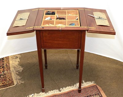 Lot 1287 - An Edwardian inlaid mahogany folding work table, raised on square tapering supports with fitted...