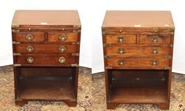 Lot 1288 - A pair of 20th century campaign style brass bound teak bedside chests, 46cm by 30cm by 66cm (2)