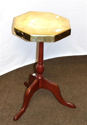 Lot 1293 - An early 19th century inlaid mahogany oval tilt-top table, a nest of three inlaid mahogany circular