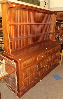 Lot 1294 - A 20th century elm dresser and rack made by Cryercraft of Bishop Thornton, circa 1980, 183cm by...