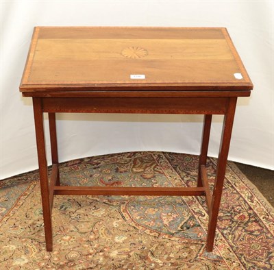 Lot 1296 - An Edwardian inlaid mahogany fold over card table together with an edwardian inlaid mahogany...