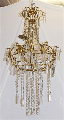 Lot 1299 - A gilt metal six light chandelier with lustre drops, approx 125cm drop