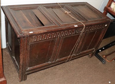 Lot 1300 - An 18th century panelled oak coffer, 128cm by 57cm by 70cm (a.f.)