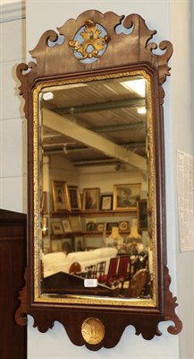 Lot 1310 - A mahogany and parcel gilt fret work mirror with campus and shelf motif, 100cm by 53cm