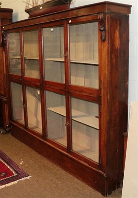 Lot 1312 - A Victorian mahogany glazed double bookcase, with adjustable shelves, painted interior, carved...