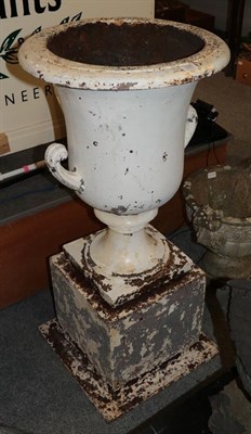 Lot 1323 - A large cast iron early Victorian garden urn on plinth, 105cm high