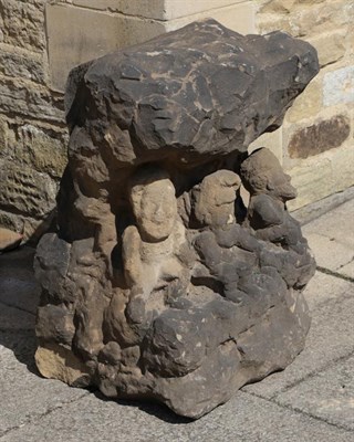 Lot 1324 - A carved sandstone garden sculpture formed as three gnomes, 74cm