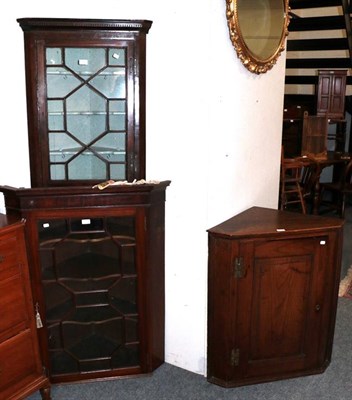 Lot 1346 - Early 19th century oak corner cupboard, a glazed corner cabinet and a glass front corner...