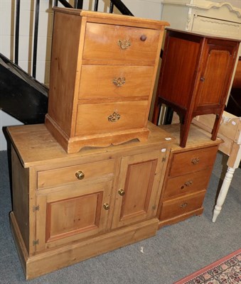 Lot 1349 - A pair of pine bedside chests, a mahogany pot cupboard, a pine side cabinet and a cane seated chair