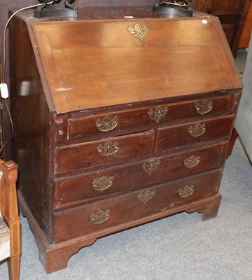 Lot 1358 - A George III mahogany fitted bureau with pierced brass handles and raised on bracket supports, 91cm