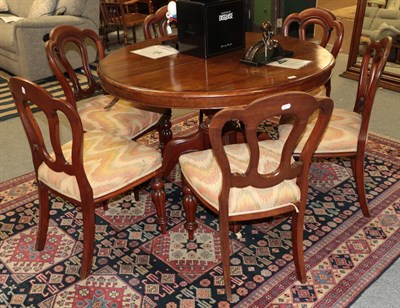 Lot 1366 - A set of six Victorian mahogany balloon back dining chairs, with stuffed seats and melon fluted...