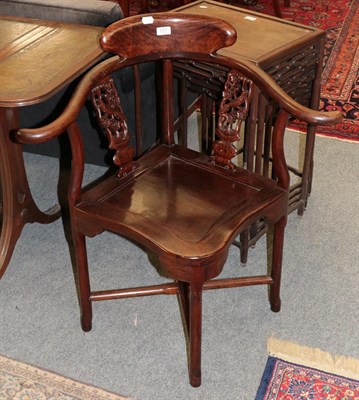 Lot 1371 - An early 20th century Chinese hardwood corner chair with a pair of carved pierced splats, decorated