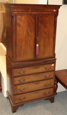 Lot 1378 - A 20th century cross banded mahogany cocktail cabinet, 72cm by 43cm by 153cm