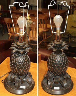 Lot 1383 - A pair of modern composition pineapple form table lamps, 44cm including fitting