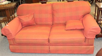 Lot 1386 - A wool upholstered two-seater sofa bed in subtle red check design, 177cm by 97cm by 90cm