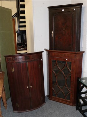 Lot 1396 - A George III mahogany astragal glazed hanging corner cupboard, 62cm by 50cm by 110cm together...