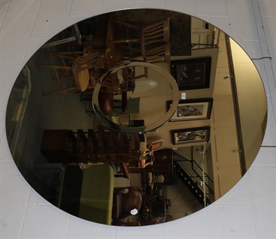 Lot 1398 - Very large circular wall mirror with bevelled borders, 150cm diameter