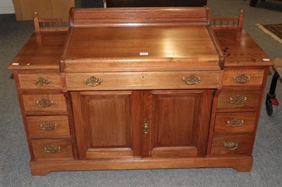 Lot 1400 - An early 20th century mahogany desk of small proportions, the central drawer with Hobbs &Co...