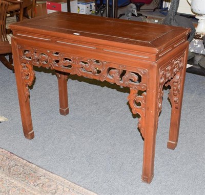 Lot 1402 - A Chinese Elm Altar Table, early 20th century, of rectangular form above a carved apron with square