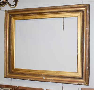 Lot 1404 - A large late 19th / early 20th century gilt picture / mirror frame, aperture 119cm by 95cm