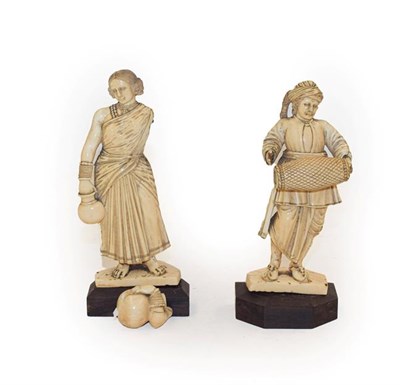 Lot 460 - Two 19th century Indo Portugese colonial ivory figures of a musician and a water carrier (a.f.) (2)