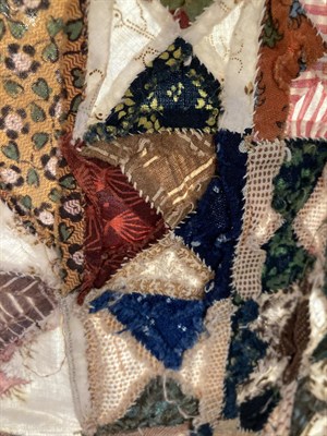 Lot 2015 - A Late 18th Century Patchwork Coverlet, comprising 4cm squares to the centre which are made up...