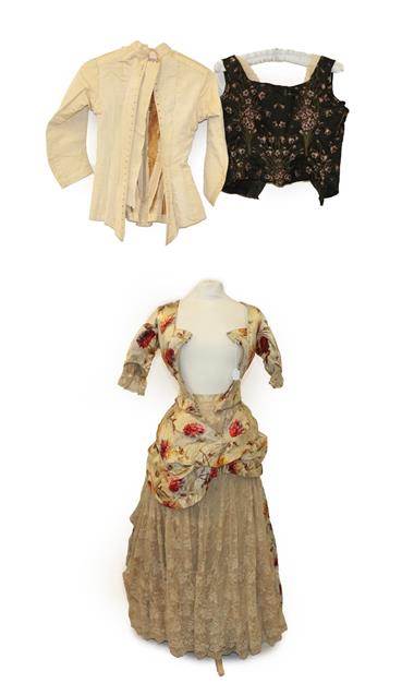 Lot 2048 - A 19th Century Dress printed with large flowerheads in pink and ochre, comprising a fitted...