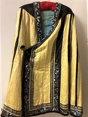 Lot 2049 - Early 20th Century Chinese Yellow Silk Brocade Cape with black silk shoulders, applied, embroidered