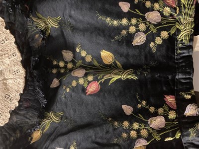 Lot 2052 - A Late 19th Century Black Silk Brocade Jacket, woven with tulips in red, yellow, and mauve,...