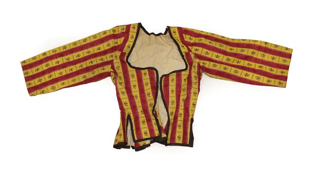 Lot 2064 - An Early 19th Century Caraco, in a glazed cotton printed with red and yellow stripes printed with a