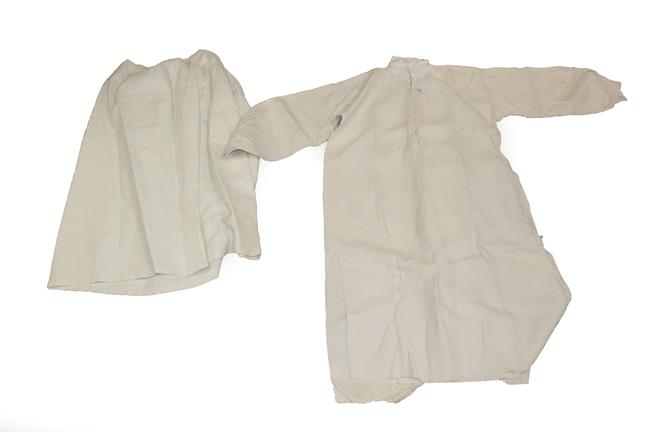 Lot 2068 - Late 19th Century Costume, comprising a coarse white cotton gentleman's shirt, buttons to the...